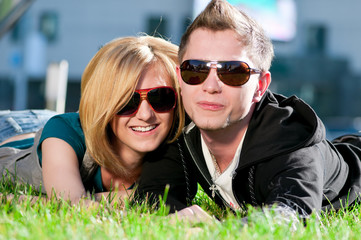 Happy teenage couple playing outdoor