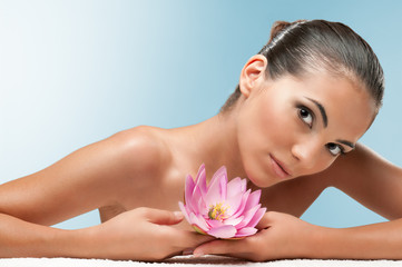 Beauty with lotus flower at spa