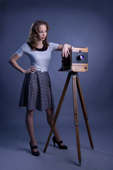 Beautiful woman with camera obscura.