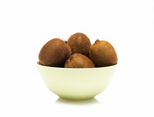 kiwi in a bowl on white
