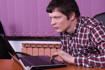 young man with a laptop