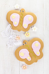 batterfly  ginger cookies with sugar flowers on white table