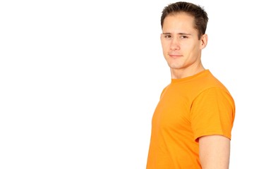 Young confident and happy man in an orange T-shirt