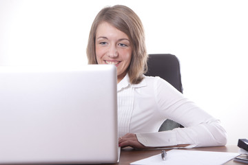 Businesswomen smile on laptop