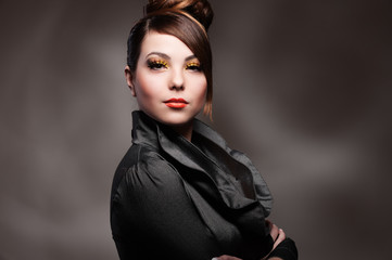 alluring young woman over dark background