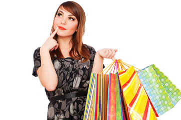 smiley pensive woman with shopping bags