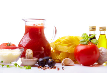 Composition of pasta, tomato, cheese, olive and garlic