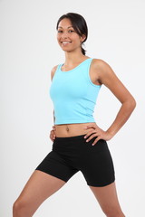 Fototapeta na wymiar Smiling athletic young woman warming up exercise