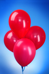 Pink flying balloons  on a blue background