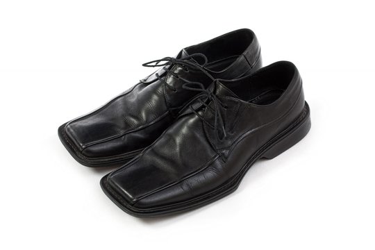Black leather shoes of man