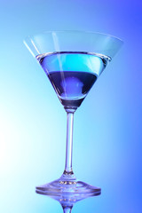 Martini glass on blue background