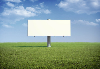 Ad billboard standing in a field of grass