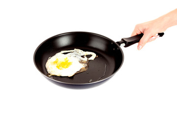 frying pan with vegetables  on white