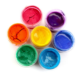 Colorful vibrant cans of gouache isolated on white