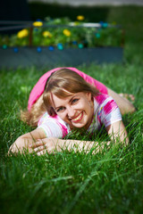 Joyful young woman on grass