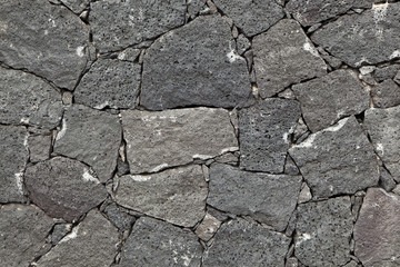 typical wall made seamless from volcanic stone