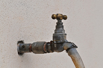 old water tap and hose