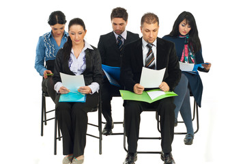 Business people at seminar reading