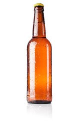Bottle of beer with drops on white background with shadow