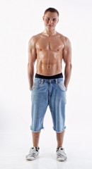 Muscular boy in jeans shorts