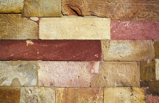 Reddish stone brick wall texture