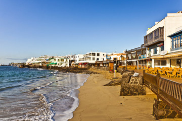 promenade of scenic Playa Blanca with seaside in the morning