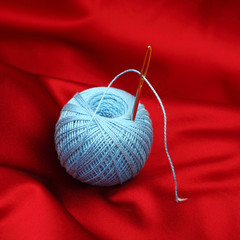 thread on red silk