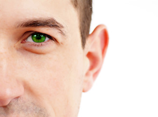 Fototapeta premium Stock Photo: Closeup of a beautiful green eye