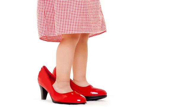 little girl in red shoes