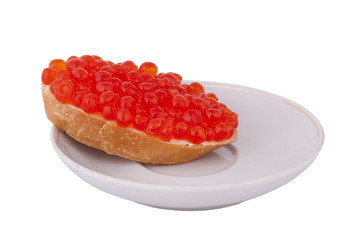 Bread with red caviar on plate on white background