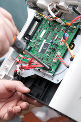 View of a circuit board being repaired. © yurmary