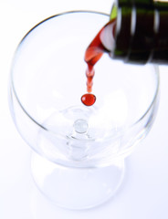 Red wine being poured into a wine glass