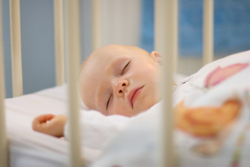 baby sleeping in crib © mbt_studio
