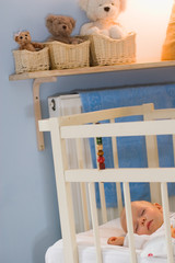 baby sleeping in crib © mbt_studio