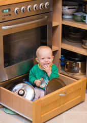 baby playing in drawer