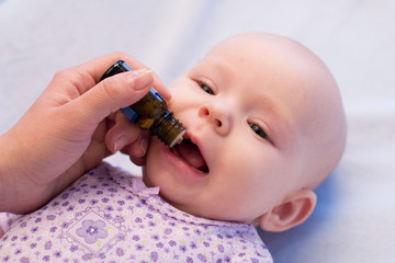 baby taking medicine