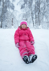 Fototapeta na wymiar a little girl in winter forest