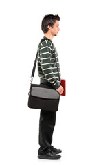 Full length portrait of a student with a bag standing in line