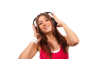 Naklejka premium Attractive fitness brunette woman listening and enjoying