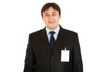 Elegant businessman with blank id card on  his jacket