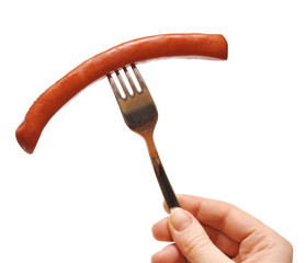 close up of sausage and fork