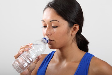 Girl feeling thirsty after a hard work out