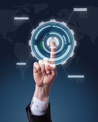 hand pushing a button on a touch screen futuristic interface