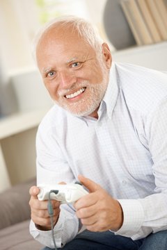 Older man having fun with computer game