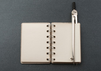 Notepad and compasses