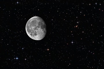 Waning gibbous moon among the stars in the background