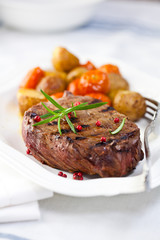 Grilled steak with baked vegetables and rosemary