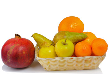 Fototapeta na wymiar fresh fruit in a basket isolated on white background