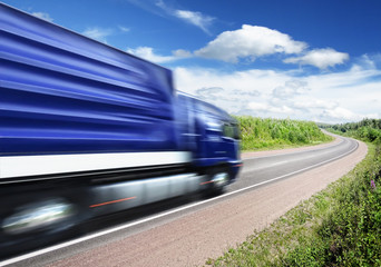 truck speeding on country highway, motion blur