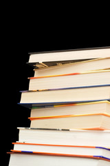 Pile of old books On a black background
